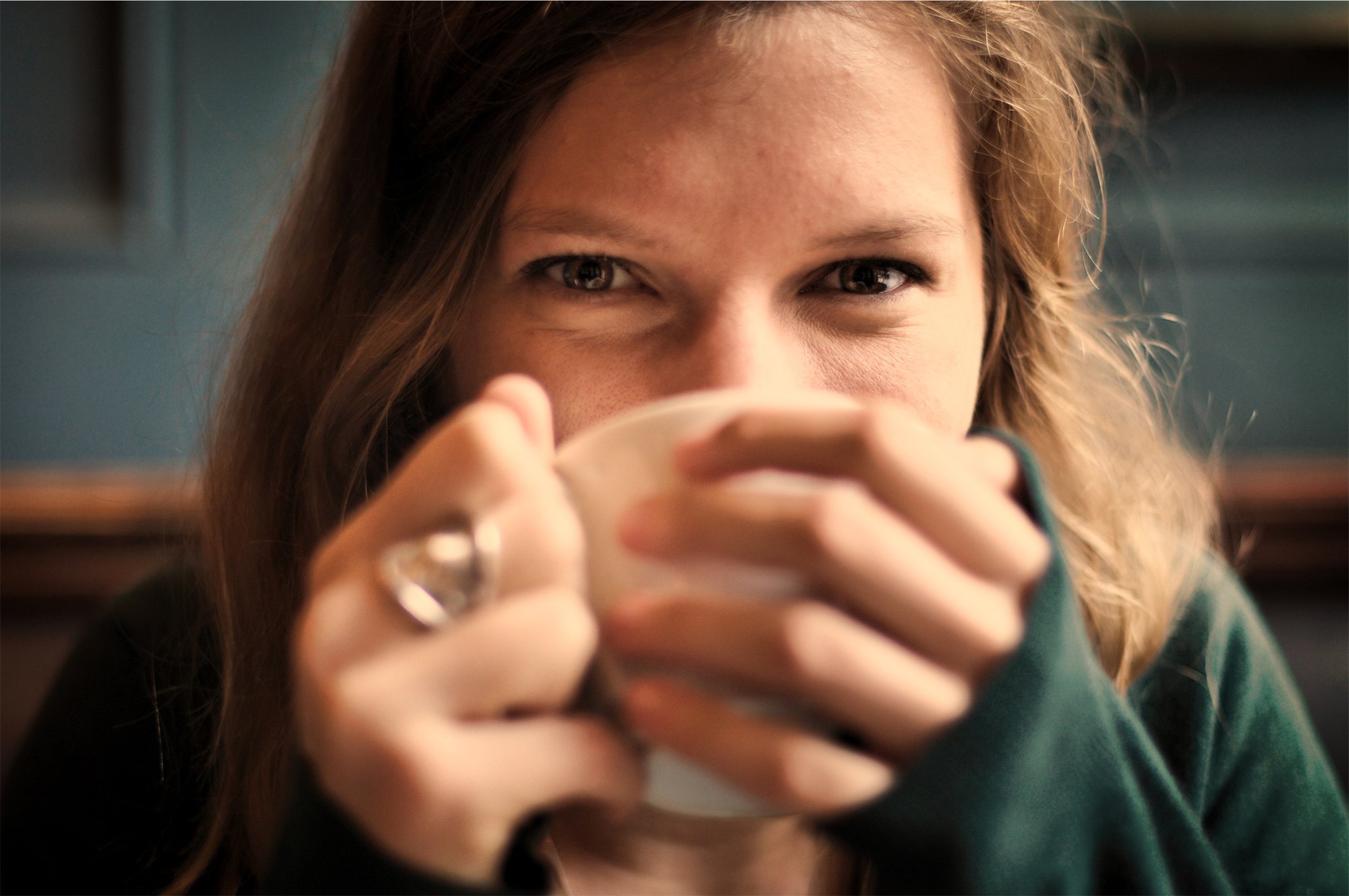 Close up of woman drinking out of a mug