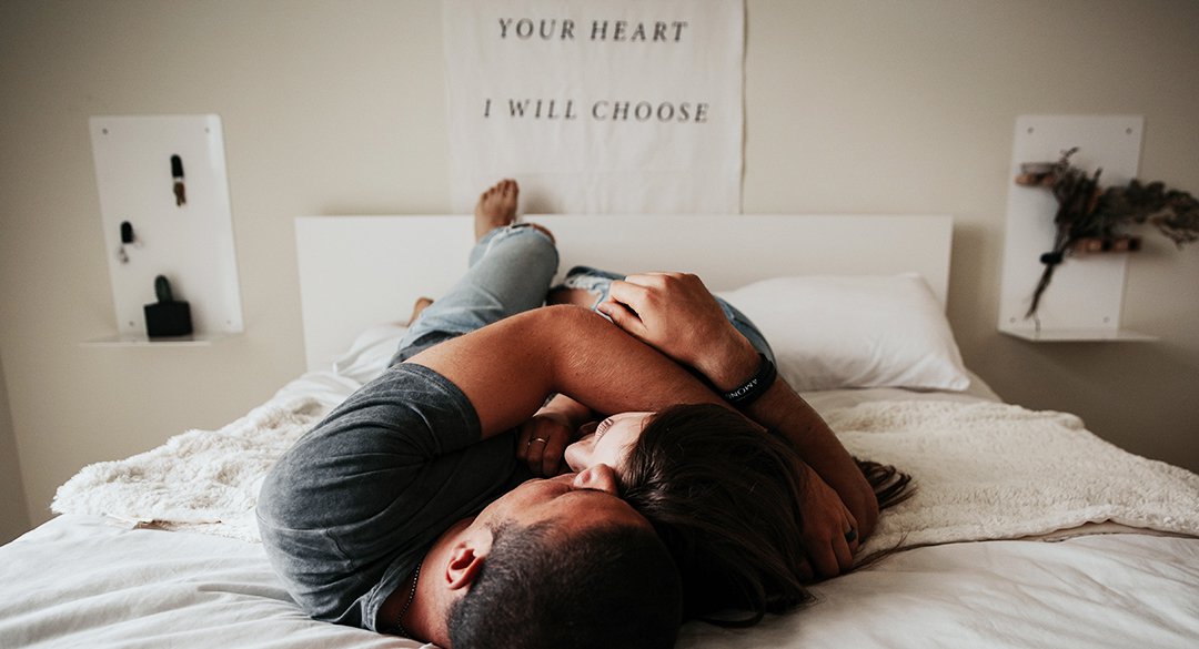 Man and woman laying in bed