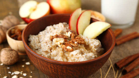 A bowl of oatmeal topped with apples, cinnamon & nuts-2.png