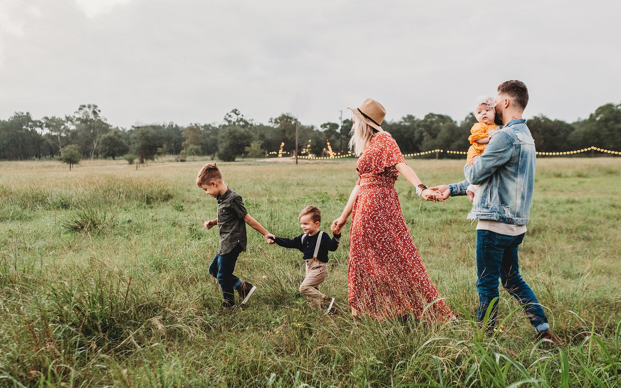 A family walking through field.jpg