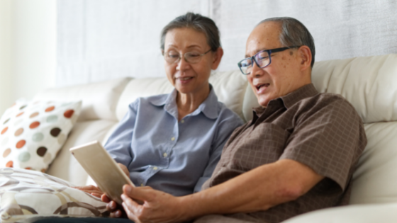 A senior couple watches a video on their tablet-2.png