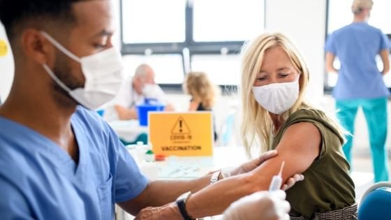 A senior woman gets her COVID-19 vaccine at a vaccine clinic-1.jpeg