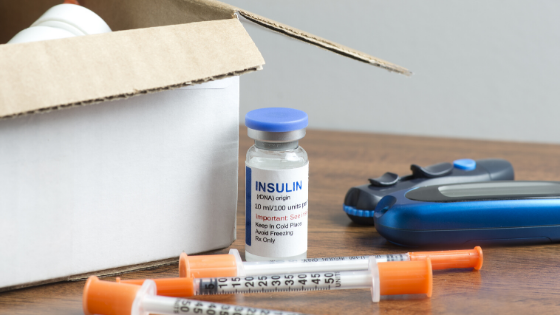A shipment of diabetes medication is seen next to a delivery box-3.png