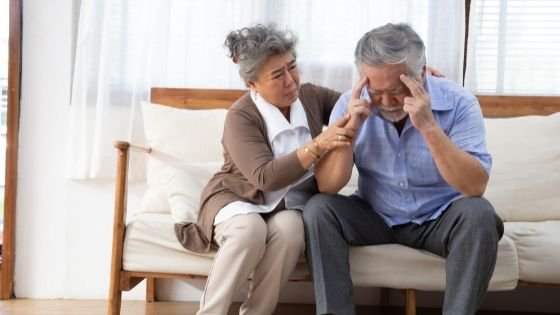 An older woman consoles an upset older man-5.jpeg
