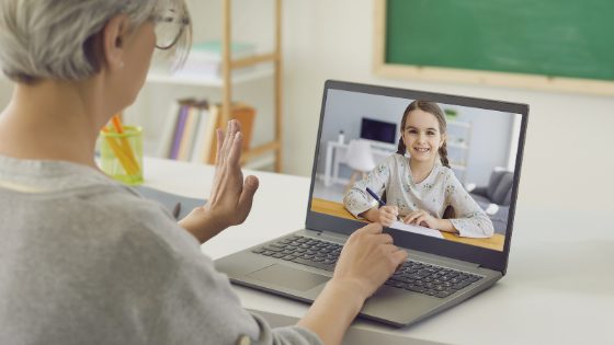 An older woman is seen video chatting with a young girl on a video call-1.png