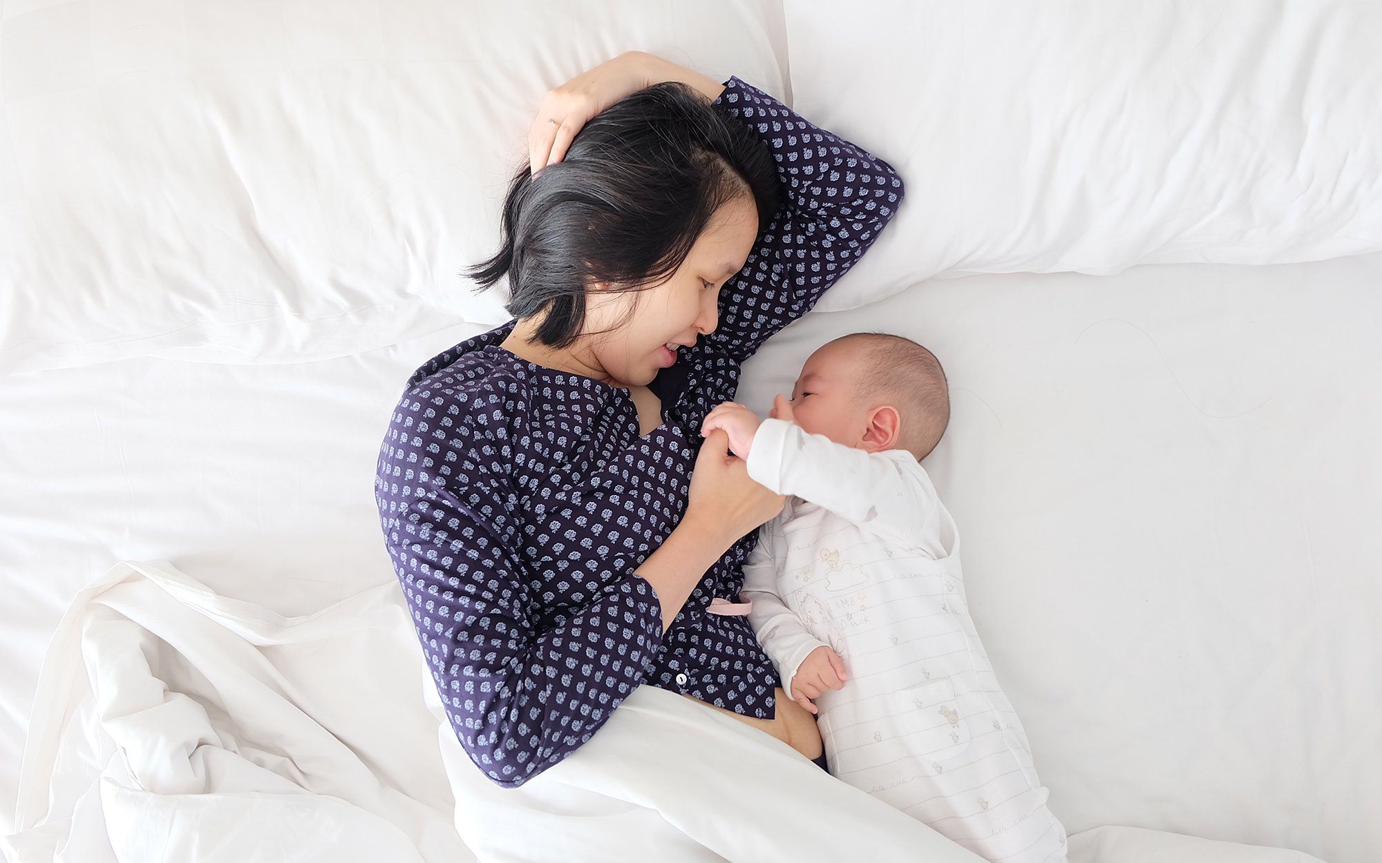 Baby and mom in bed.jpg