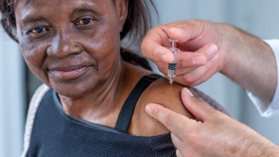 Close up of a senior black woman is seen getting a shot-4.jpeg
