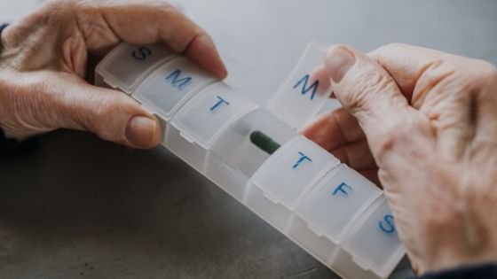 Close up of a senior opening their daily pill box - 5.jpeg