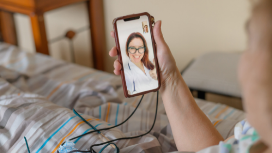 Close up of a sick senior woman on a video visit with her doctor-4.png