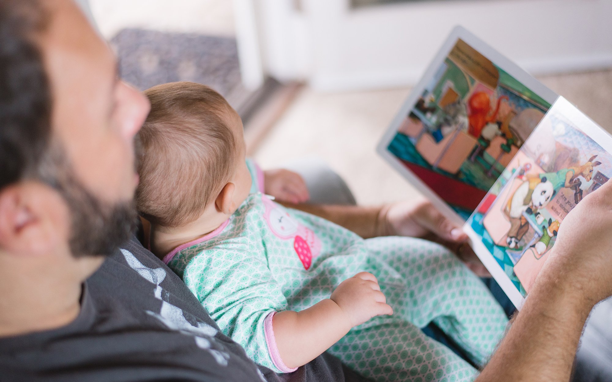 Dad and baby reading.jpg