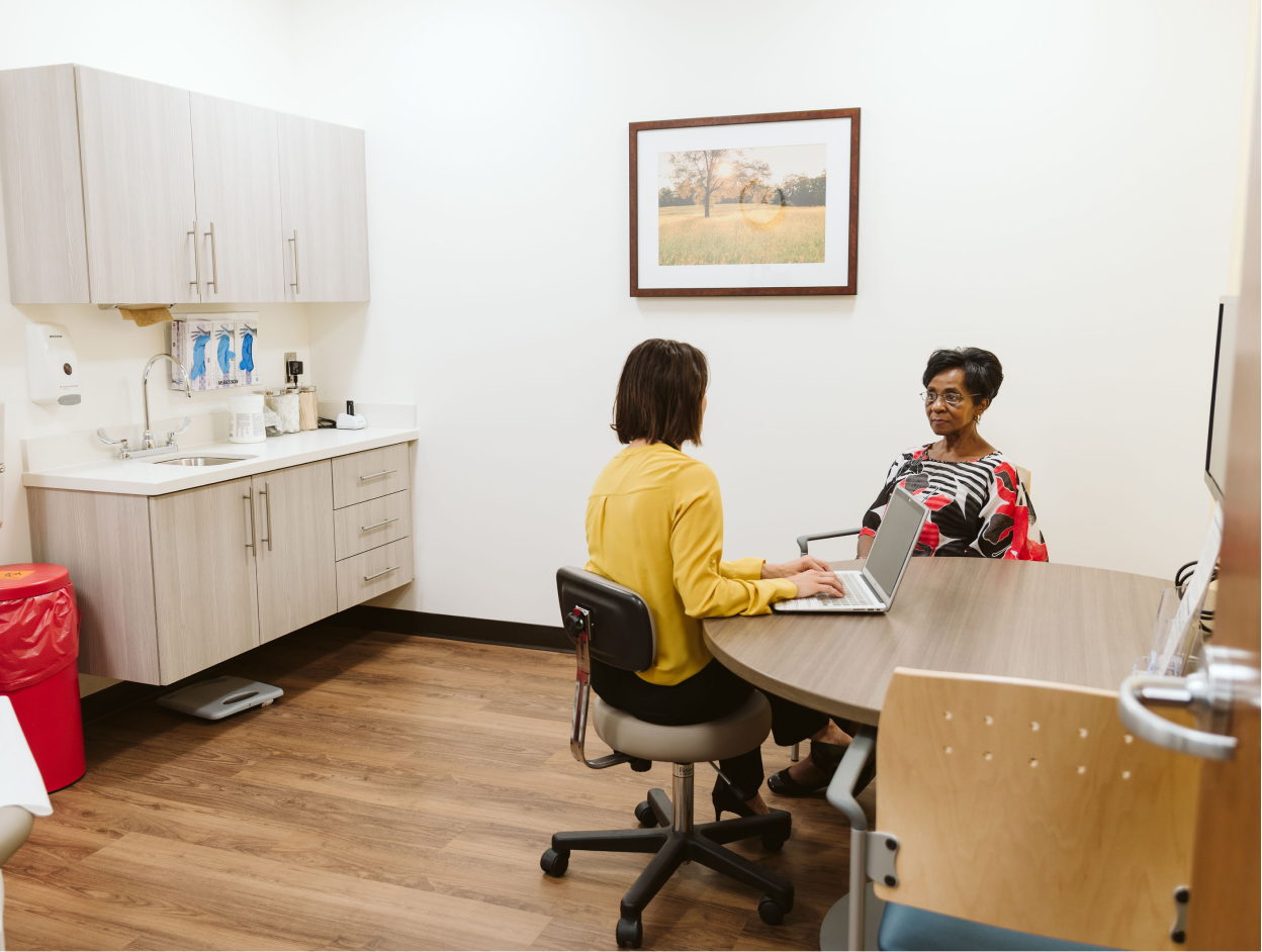 Female provider in room getting info from patient.png