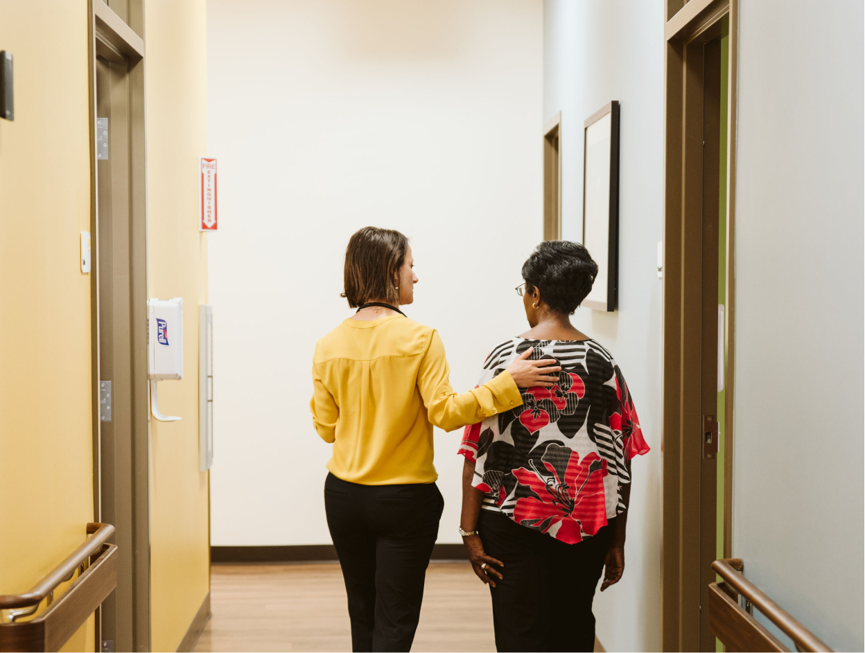 Female provider with hand on patients back.png