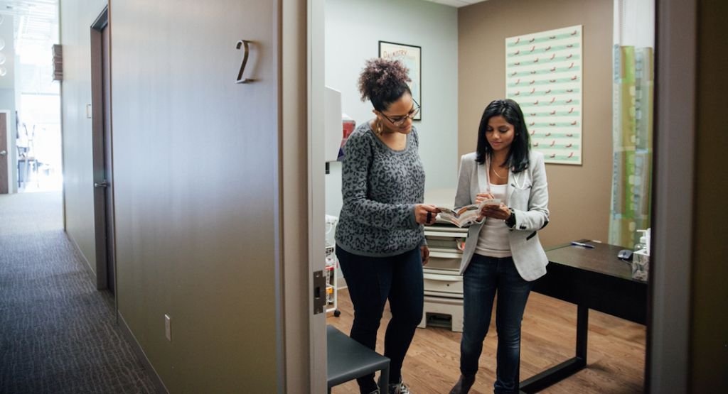 Patient and doctor consulting a pamphlet