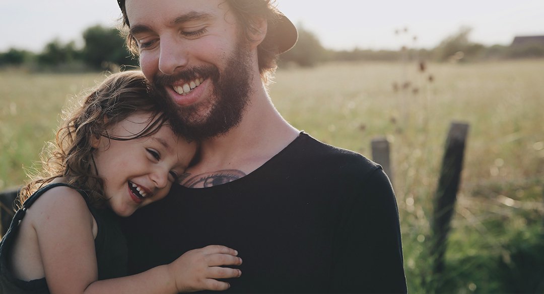 Man and daughter laughing