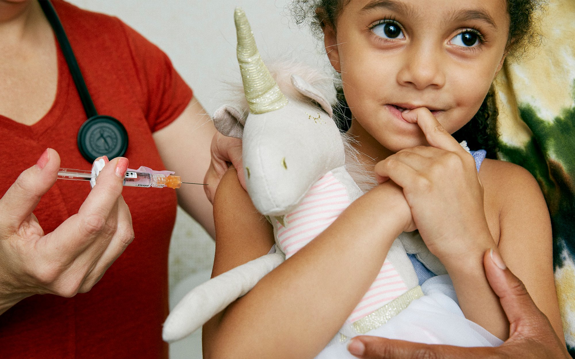 Little girl getting flu shot.jpg