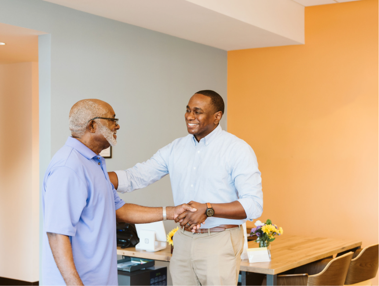 Male provider shaking patients hand