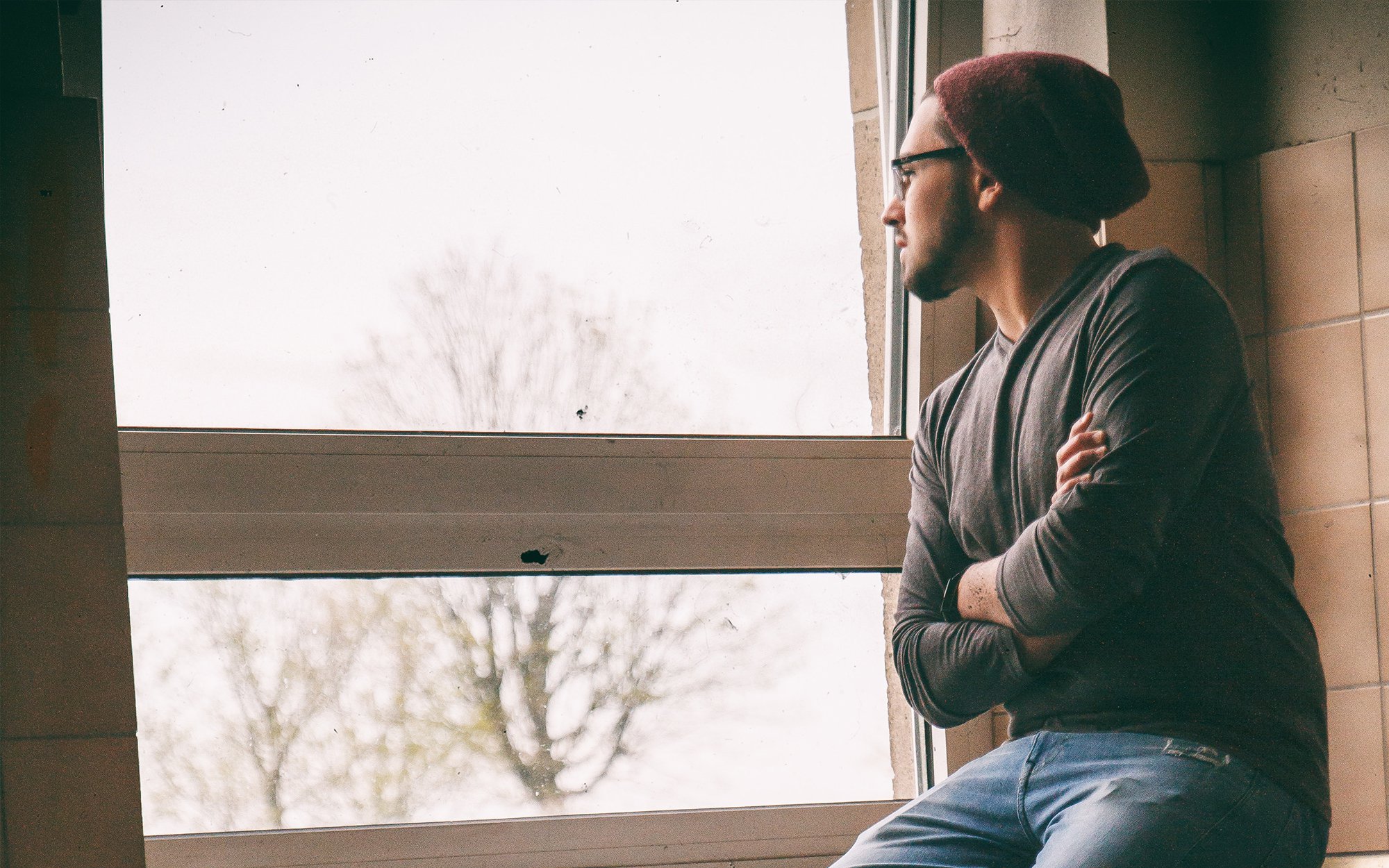 Man Looking Out Window.jpg