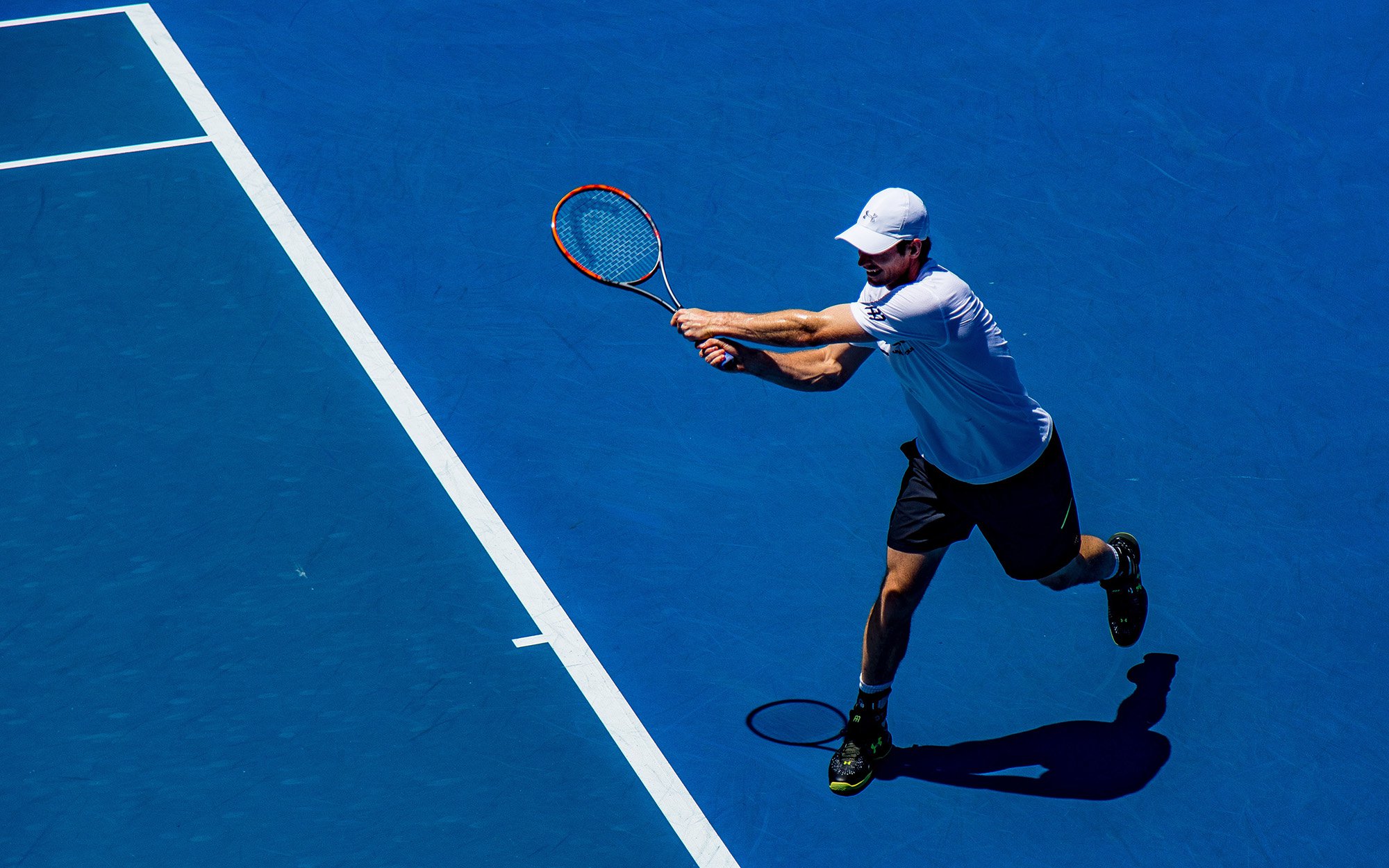 Man playing tennis.jpg