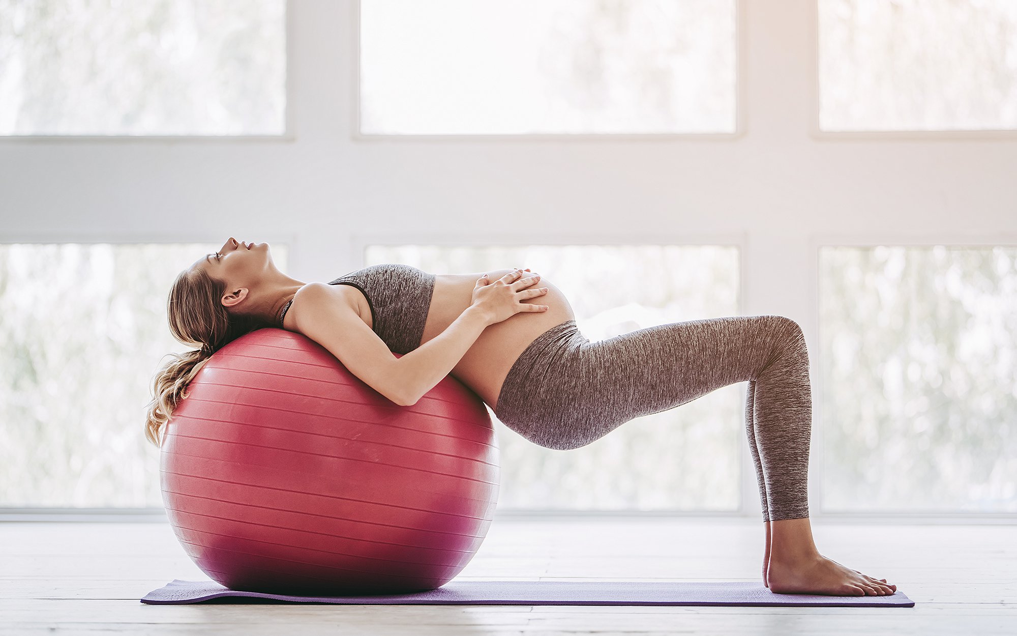 Pregnant woman stretching.jpg