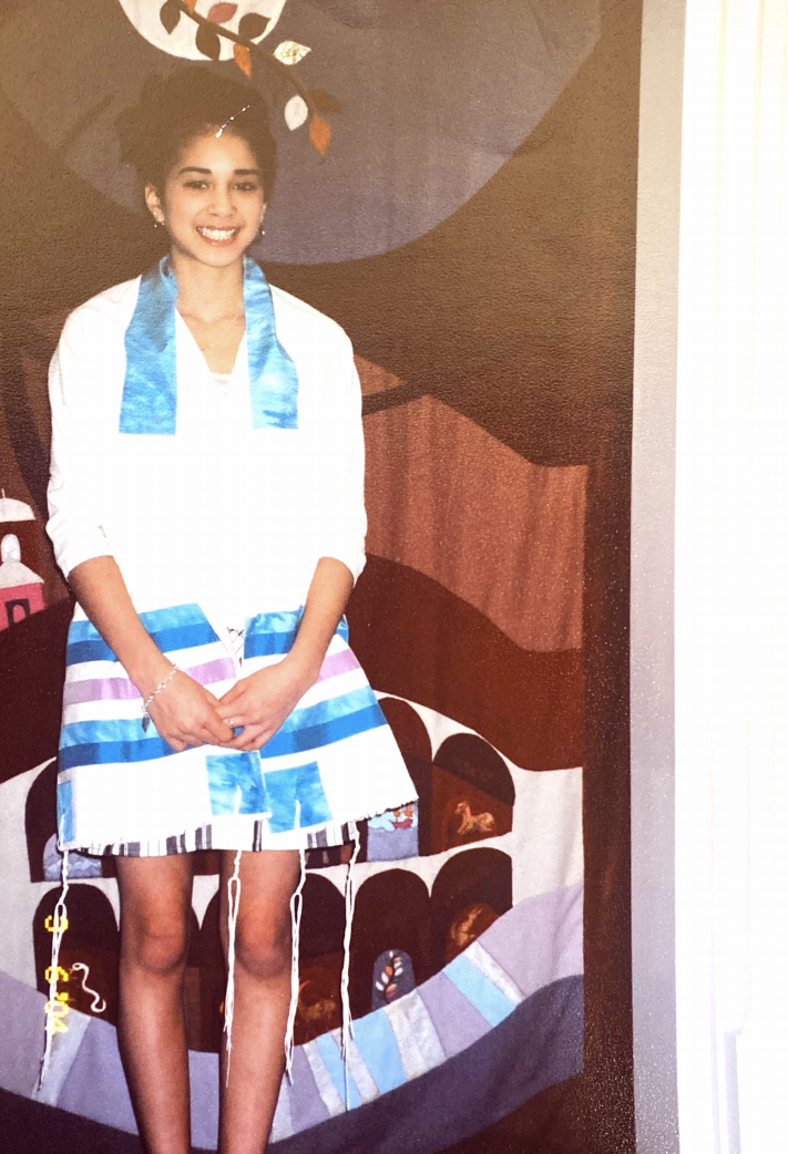 Annie as a teenager posing at her bat mitzvah.