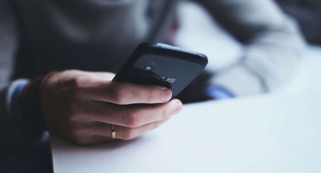 Close up person holding a phone