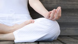 Women in lotus position during yoga