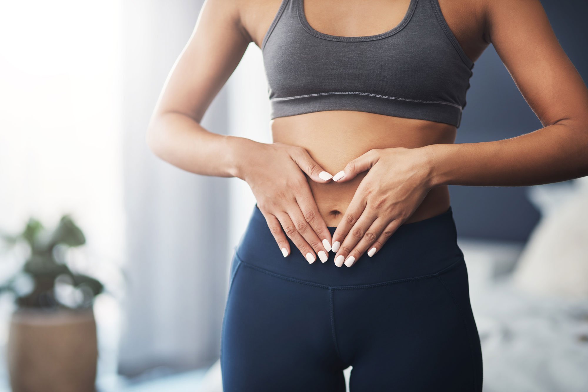 Woman holding stomach