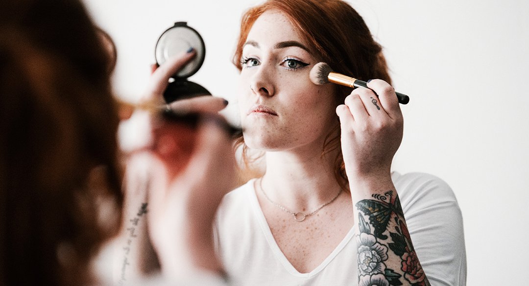 Woman doing her makeup