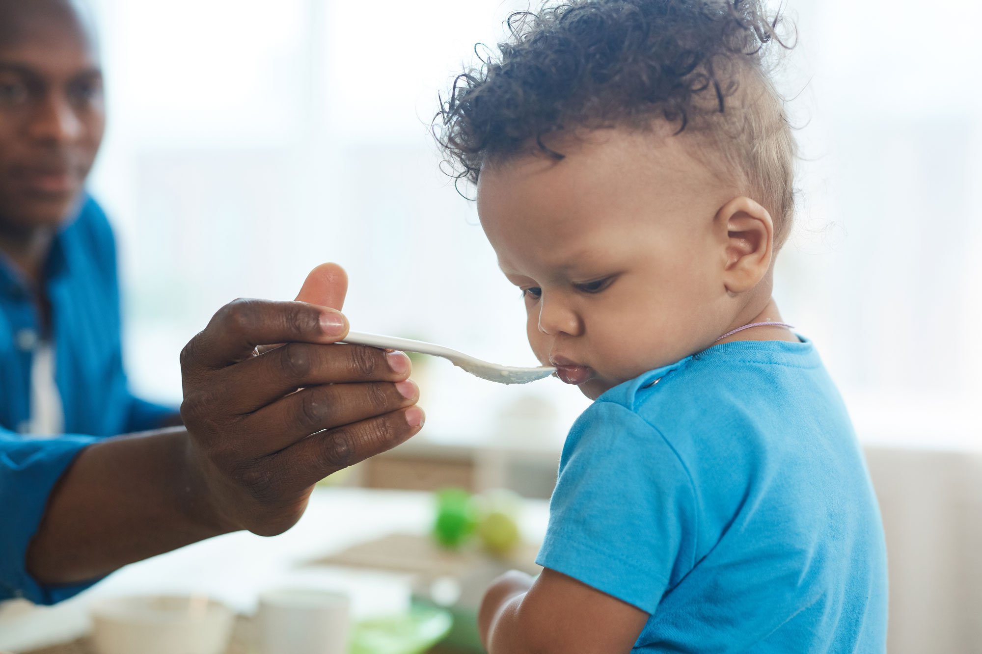 Baby looking away from spoon and refusing to eat food