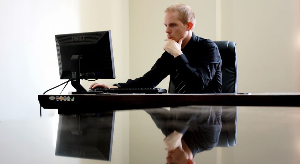 Man looking at a computer