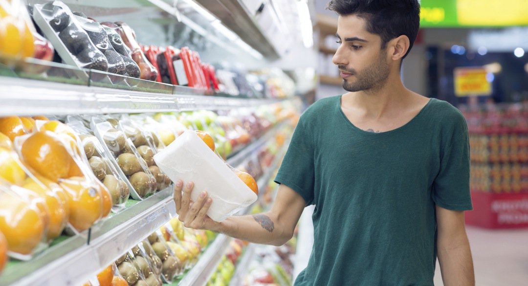 Man holding package in a grocery store