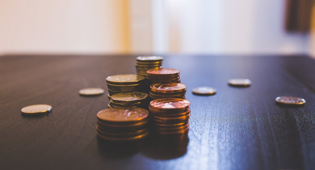 Coins sitting piled on a table