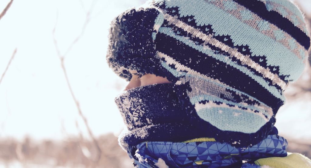 Person wearing a hat in snow