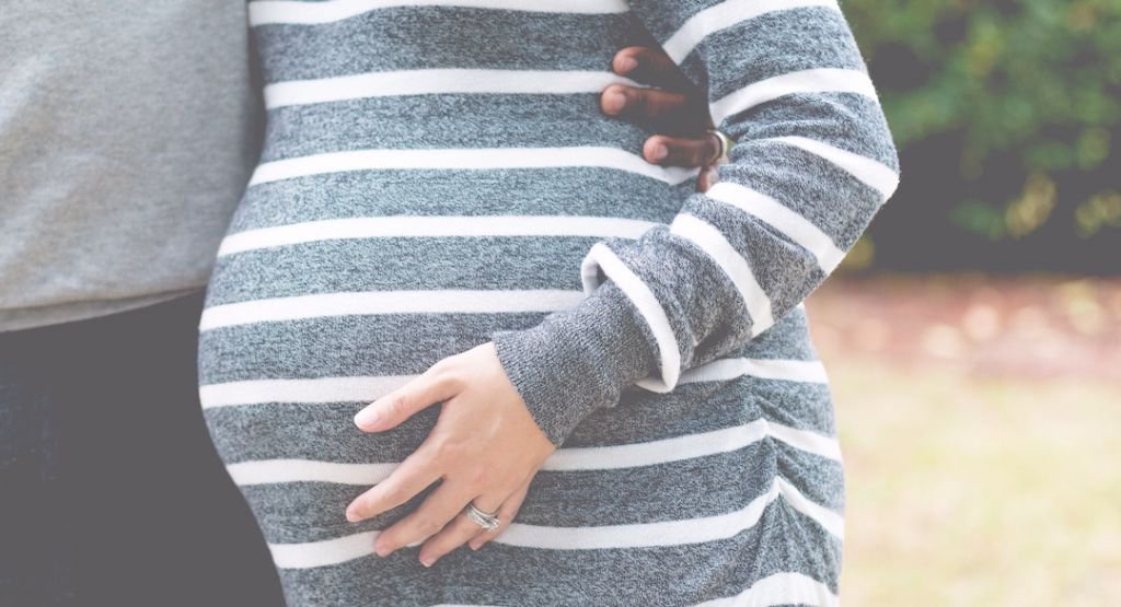 Close up of a pregnant woman's midsection