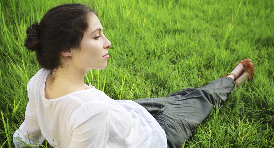 Woman laying in the grass