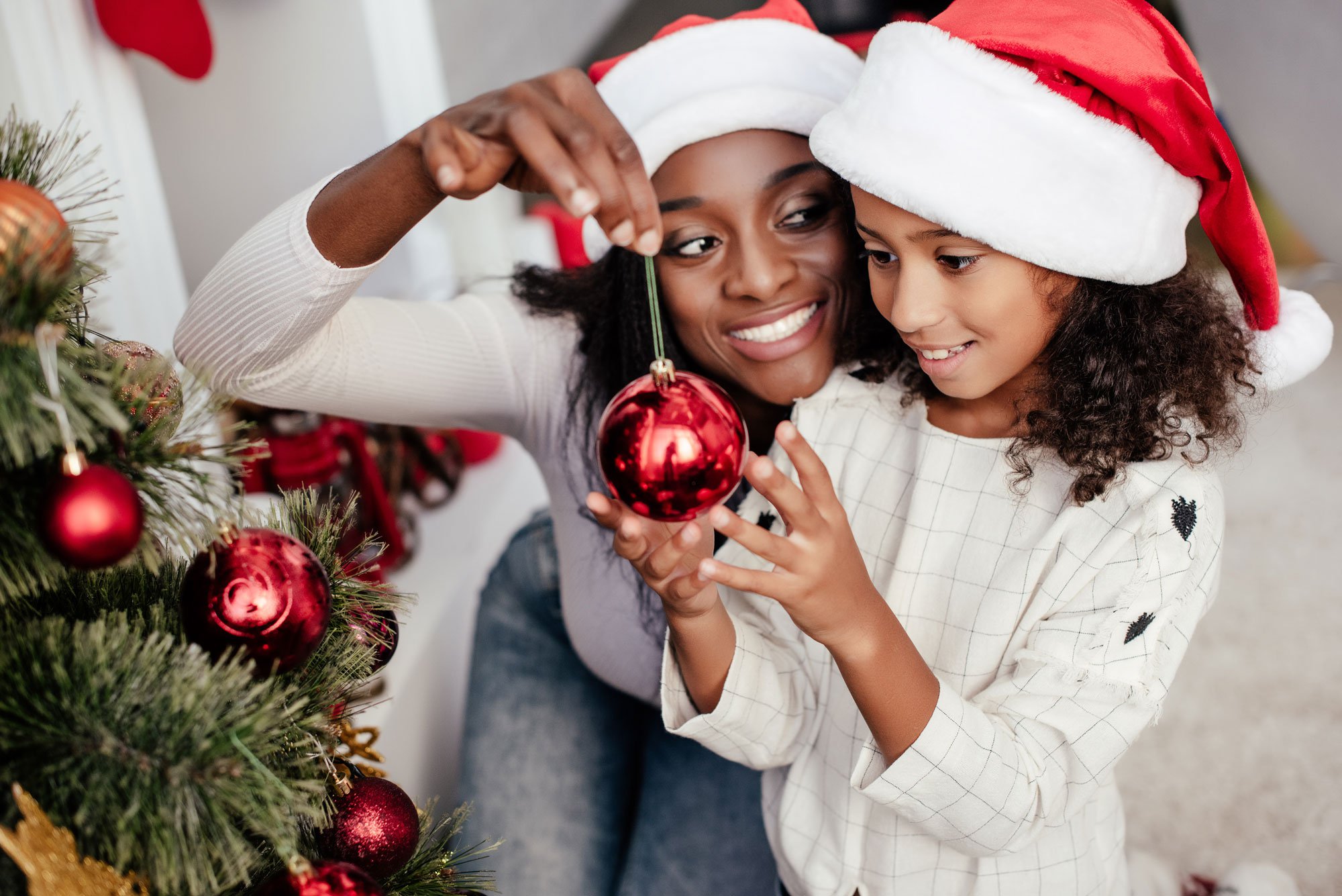 girl-hanging-christmas-ornament.jpg