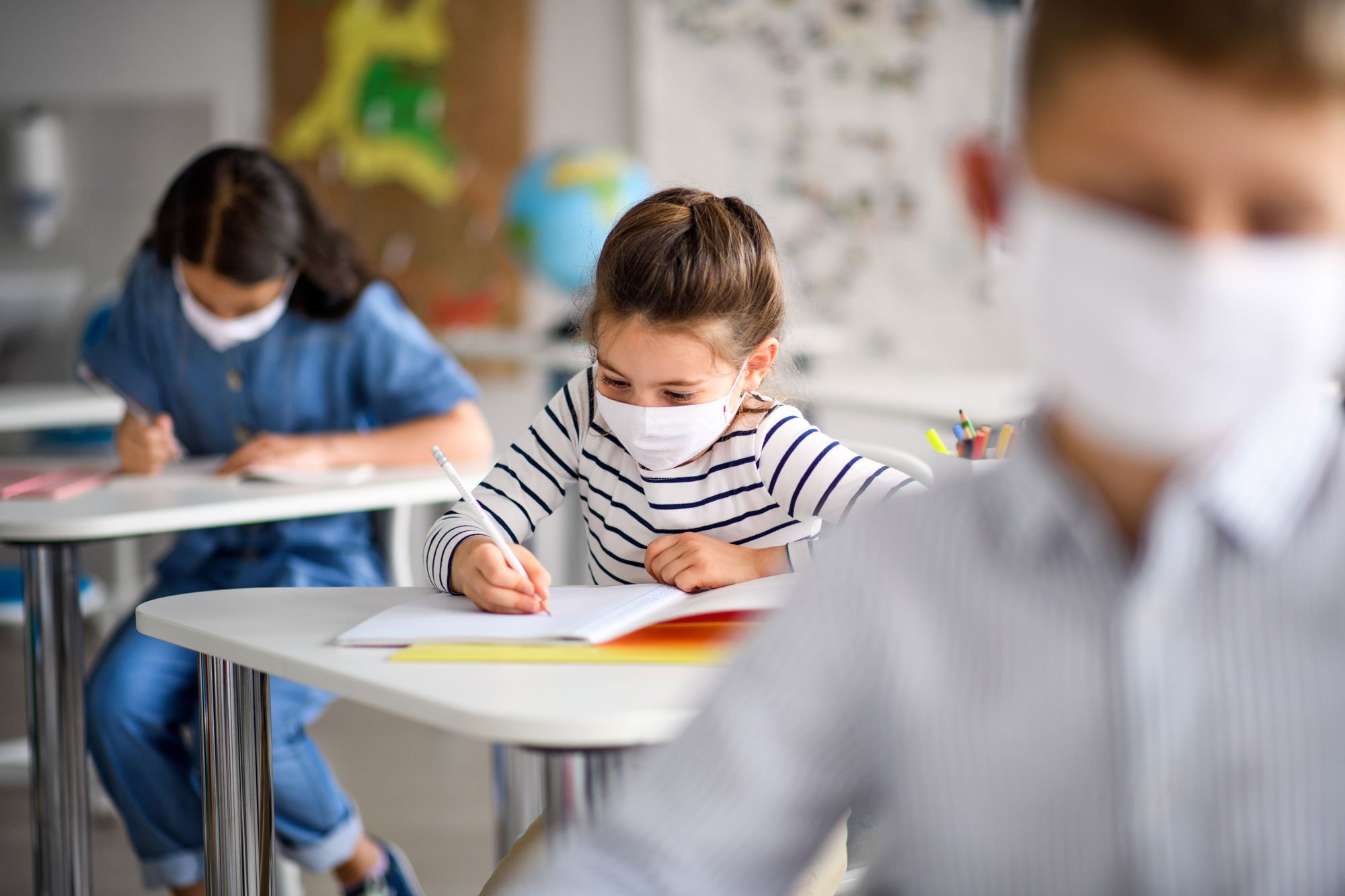 girl wearing mask classroom