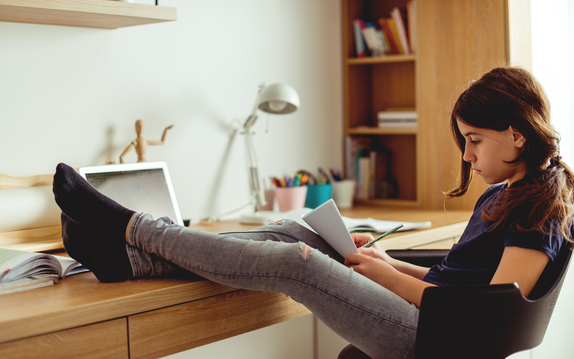 girl at desk writing.jpg