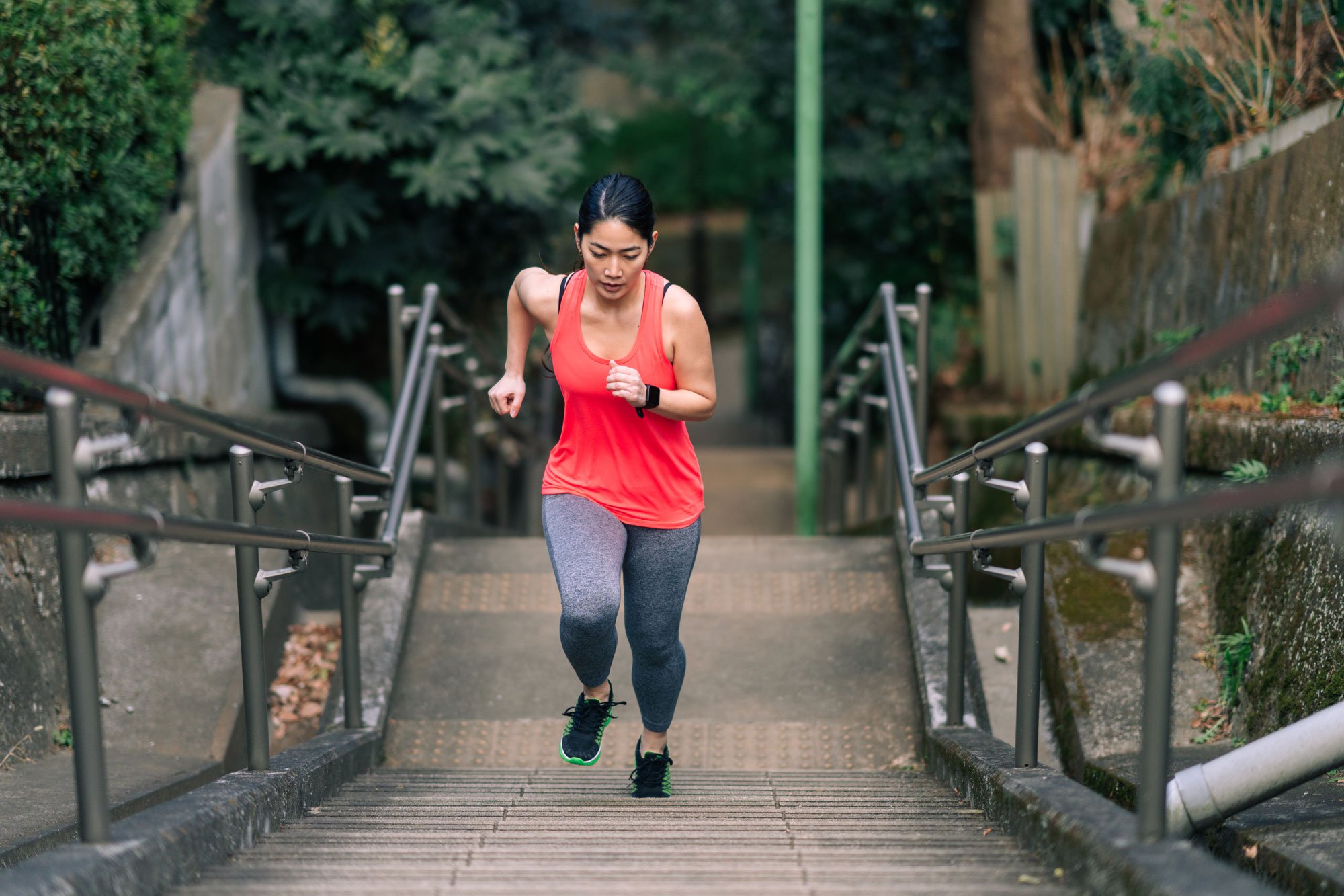 Woman running up stairs