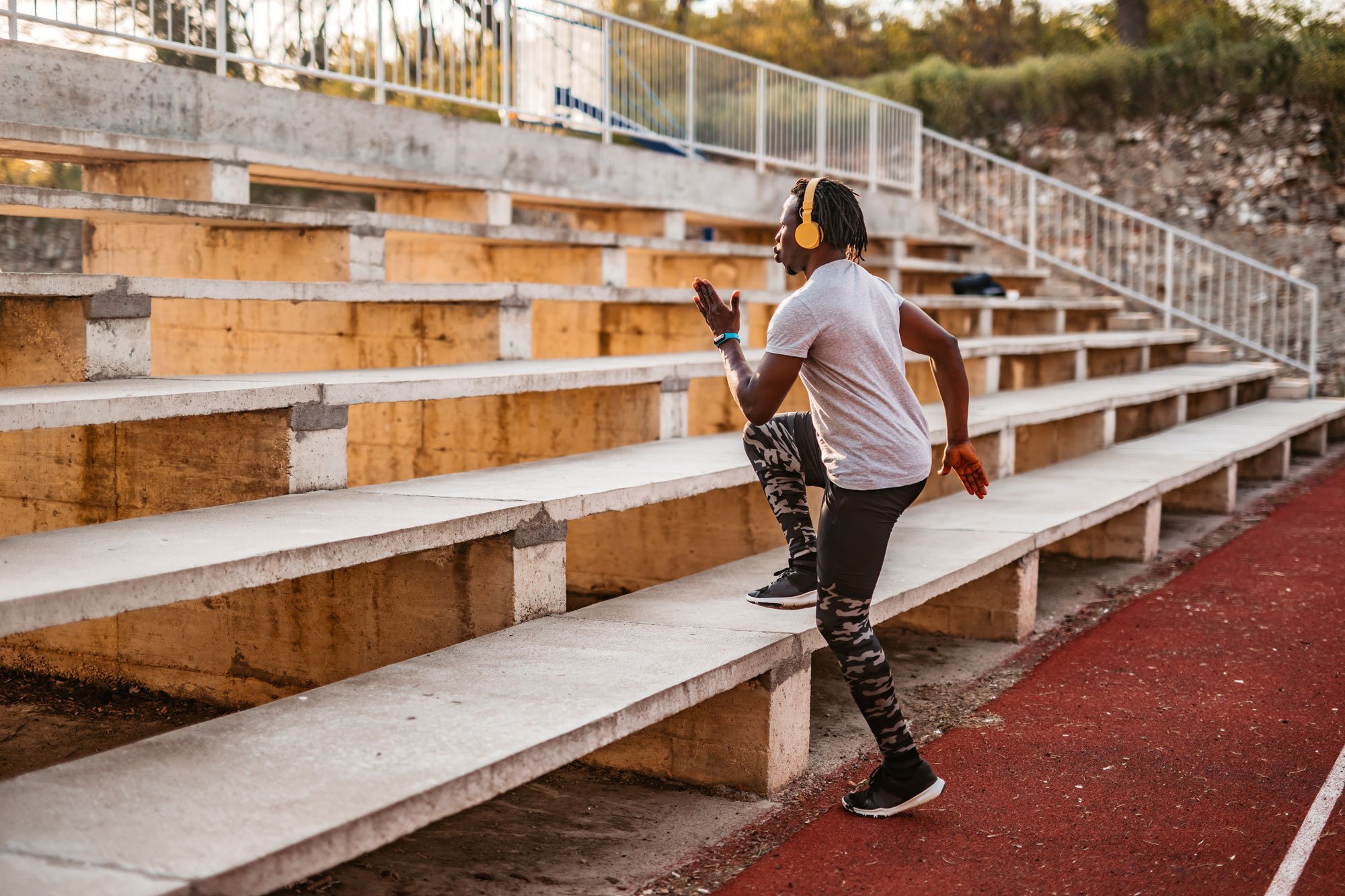 Man doing cardio on bleachers