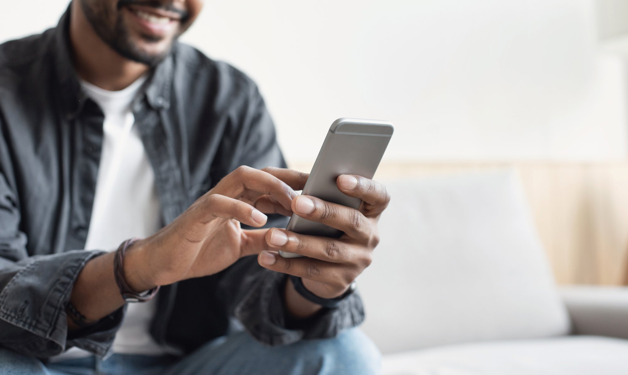 Man looking down at phone