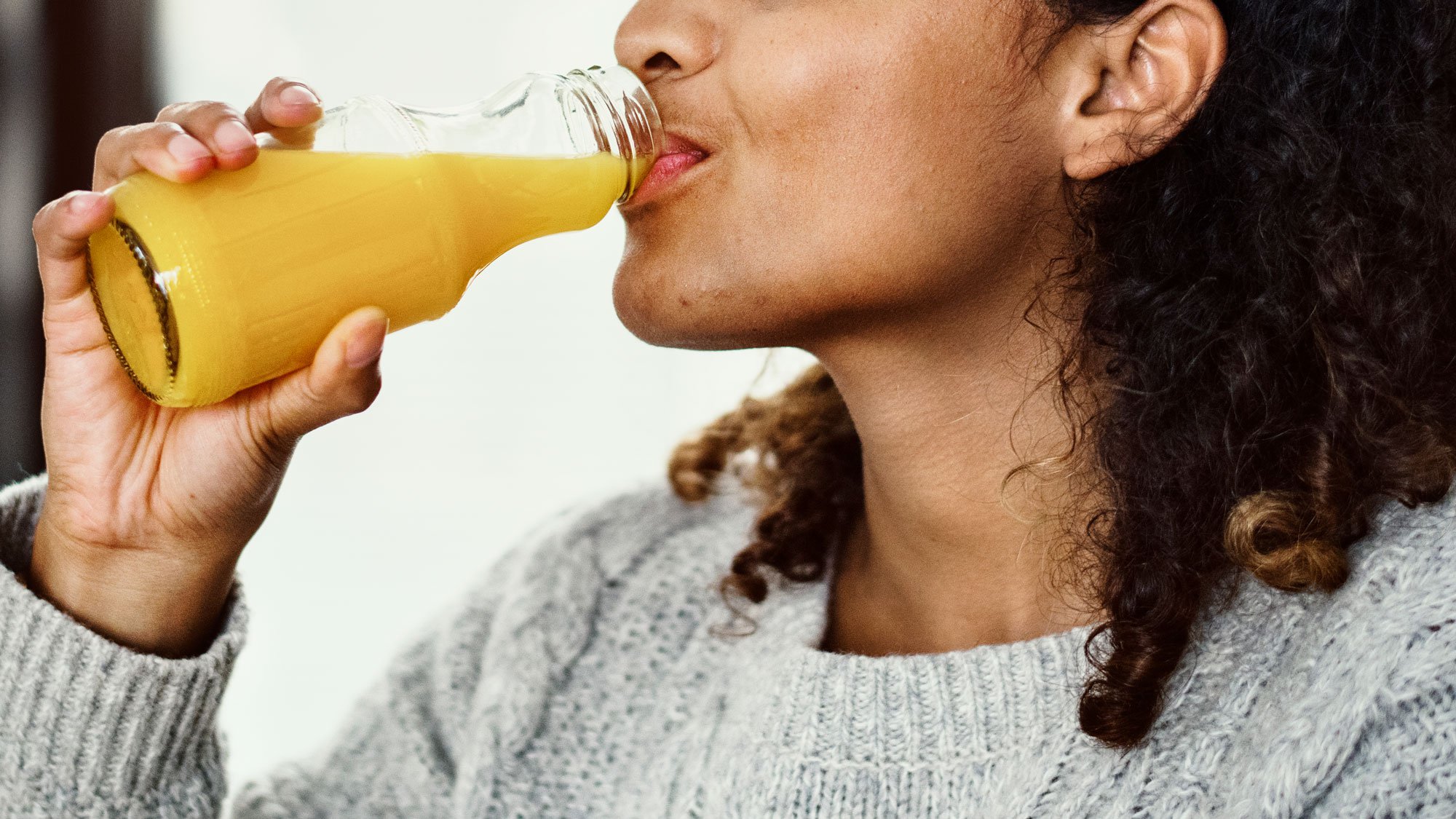 Woman drinking orange juice