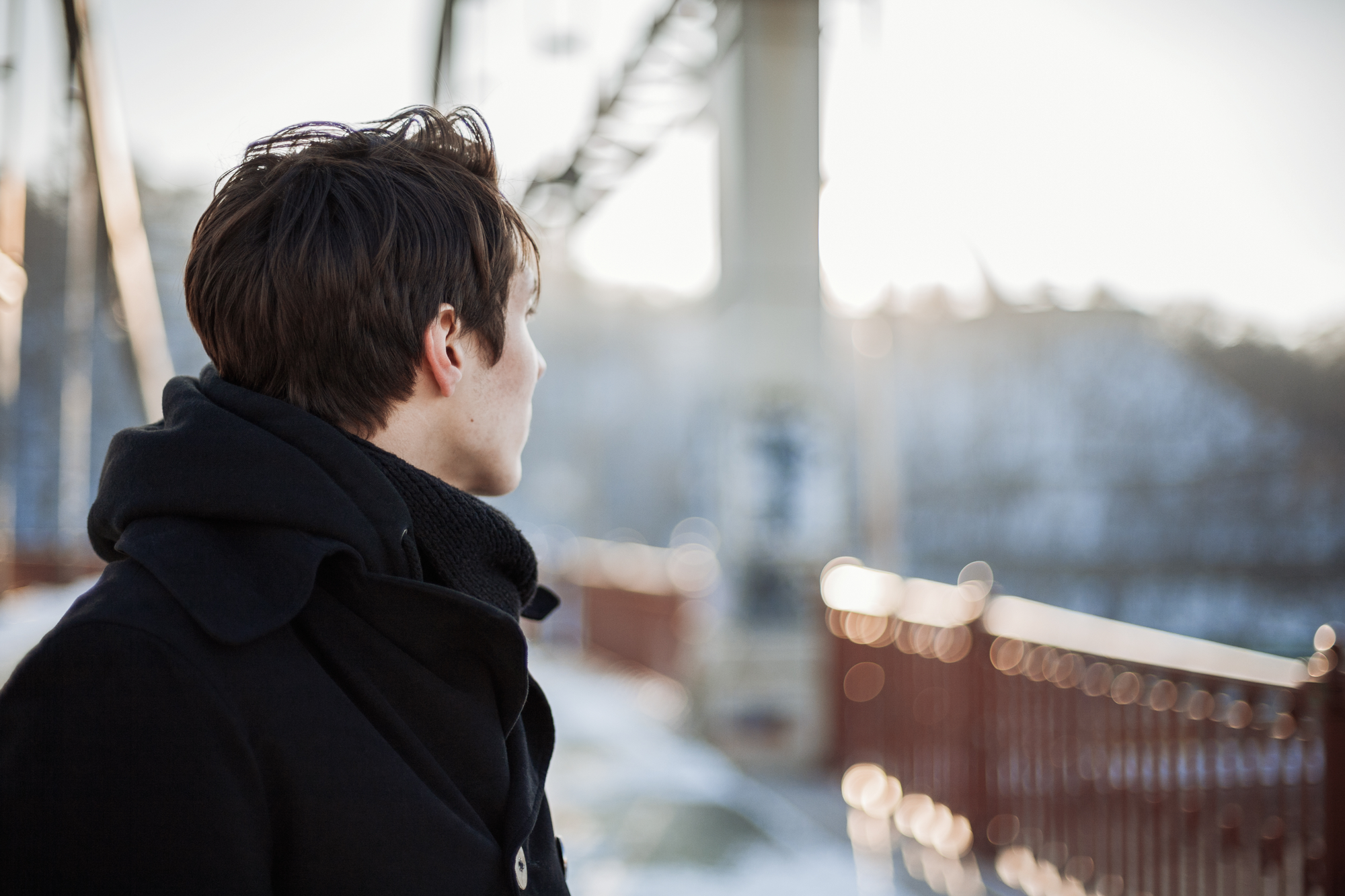 Young man looking out at the snow