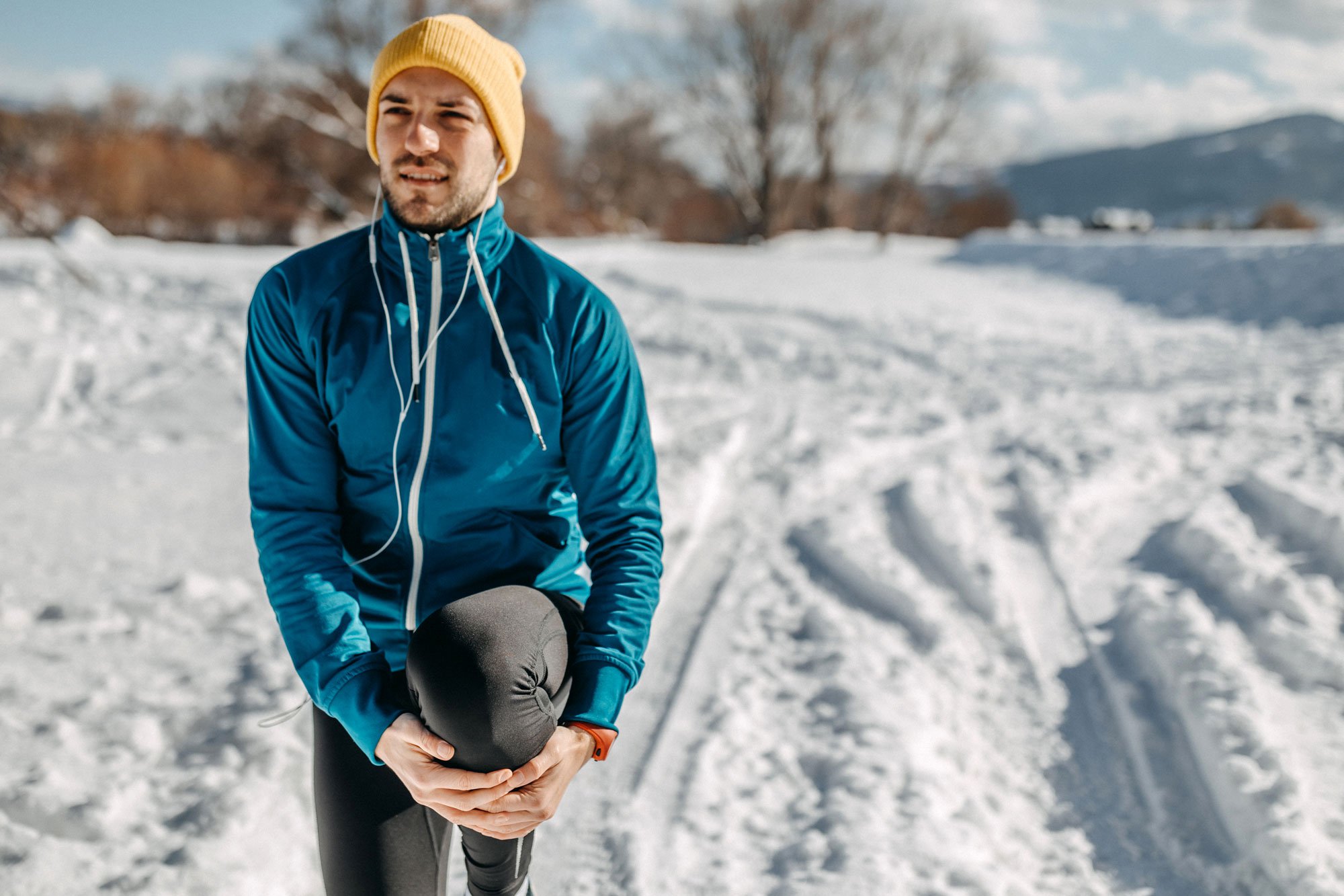 man-stretching-in-snow.jpg