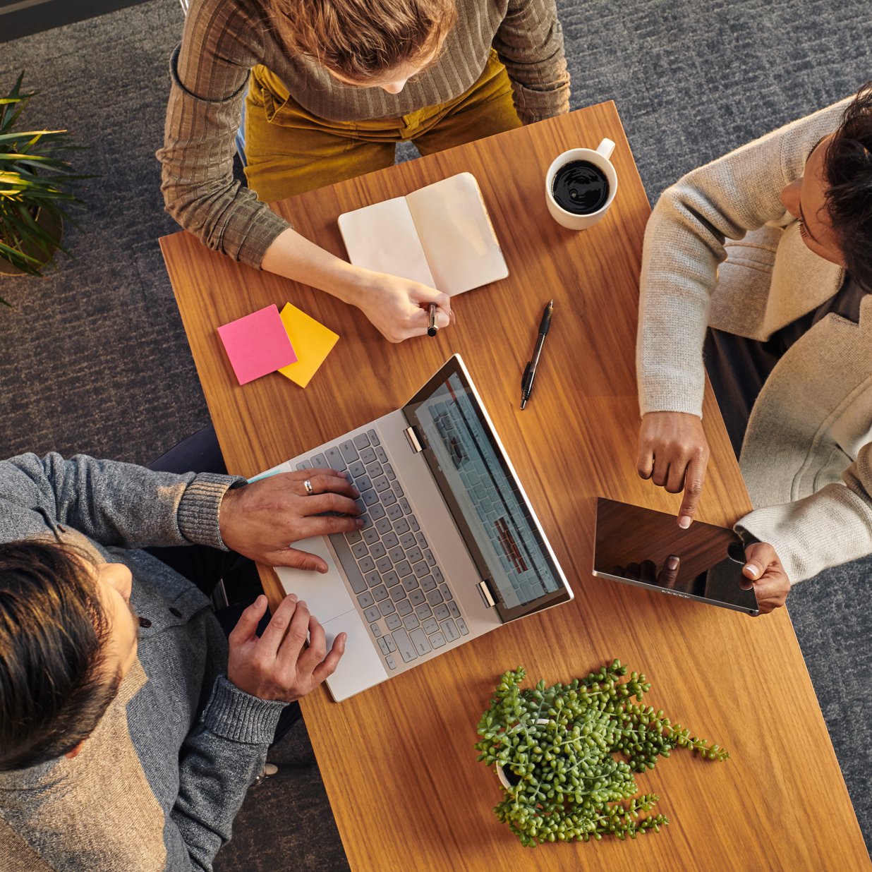 Overheard image of three people working