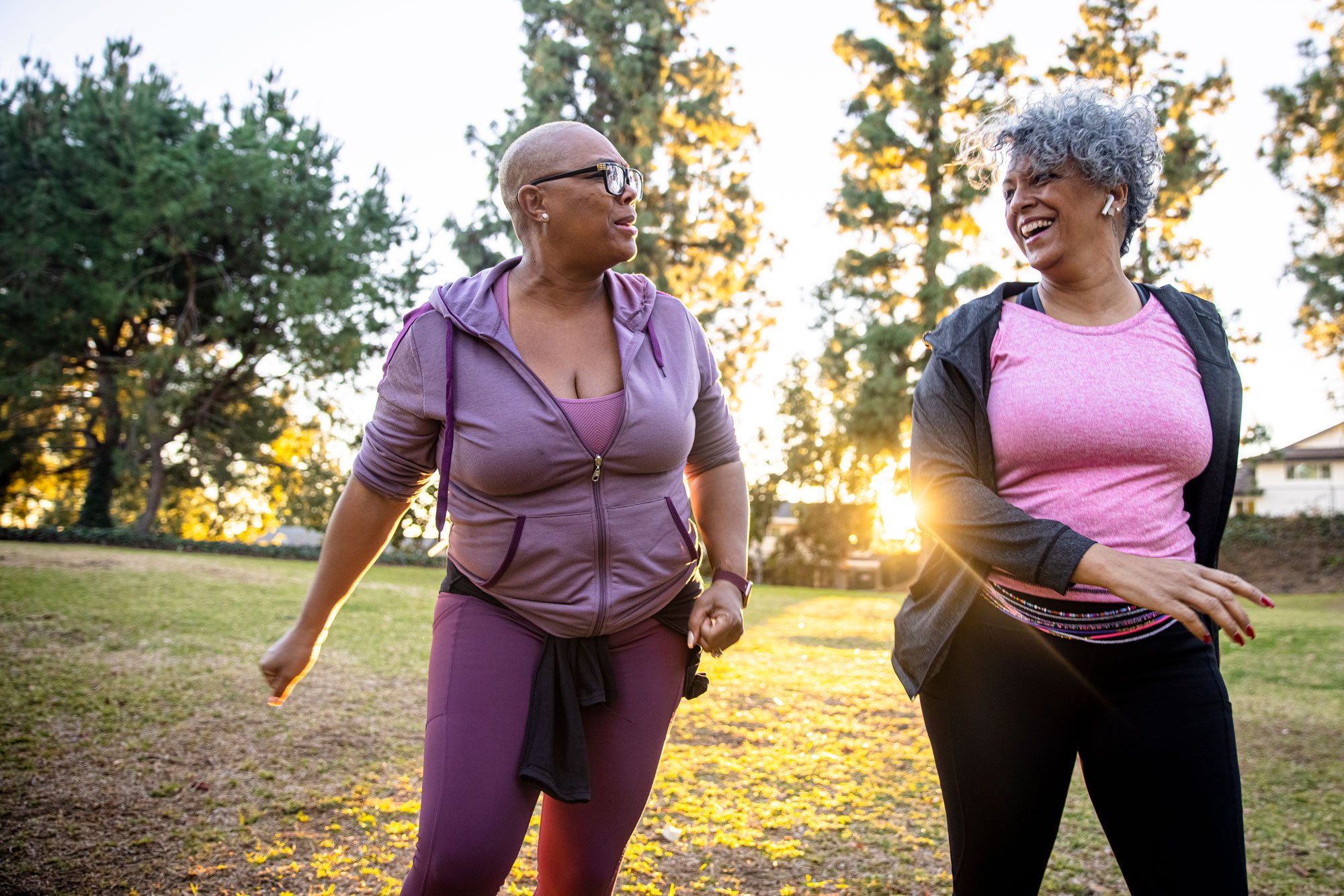 Two women walking in a park and talking