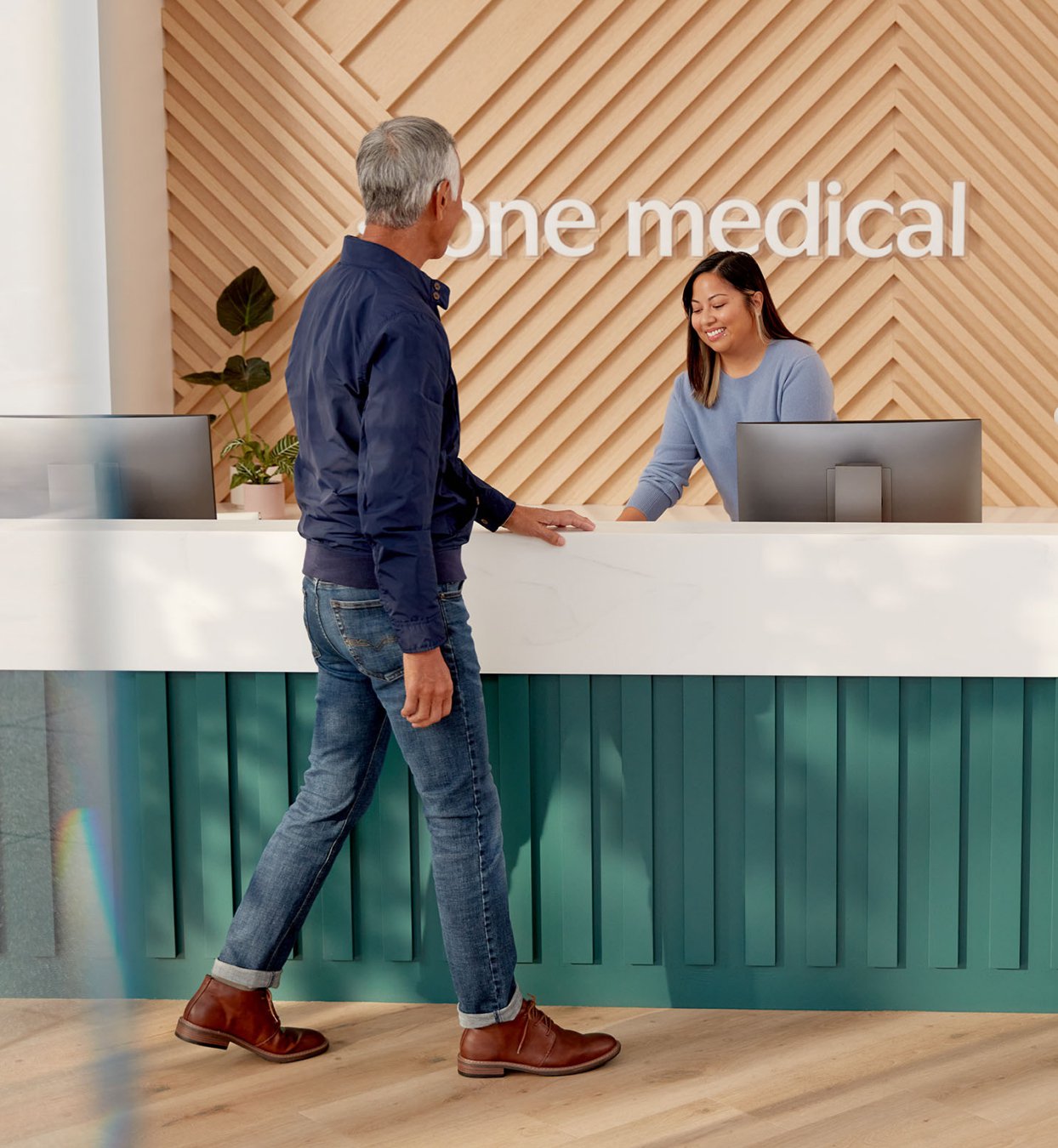Man at One Medical front desk