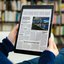person-reading-news-on-tablet.jpg