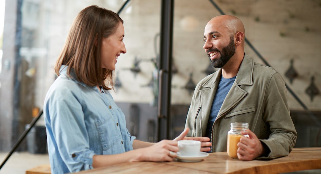 Two providers drinking coffee and talking