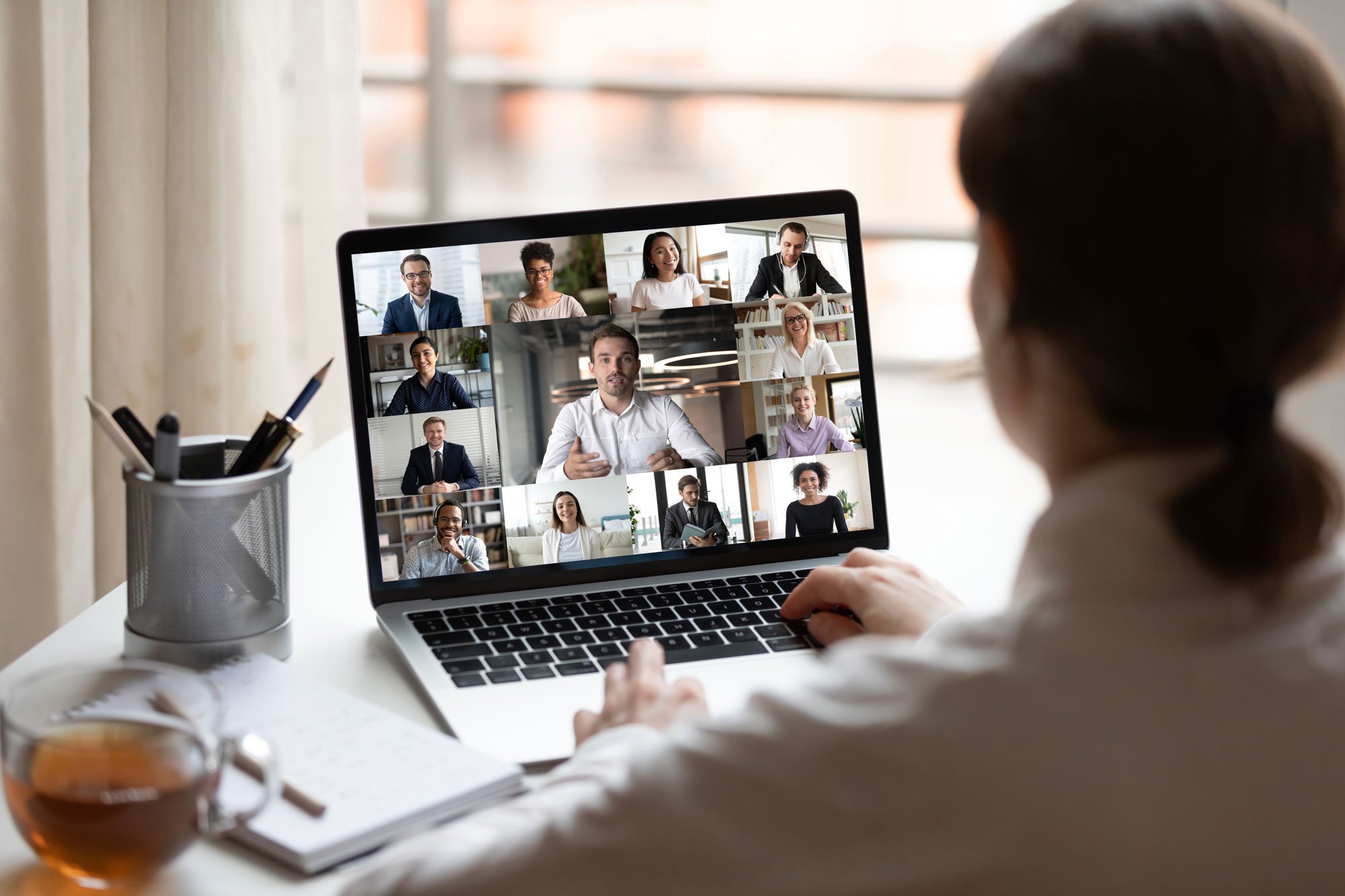 Person looking at computer screen for video conference